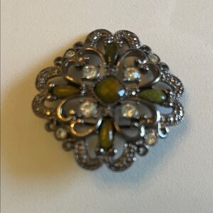 Ornate Brooch with Green and Silver Tones